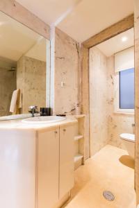 a bathroom with a sink and a toilet at Your Lisbon Home Bairro Alto II in Lisbon