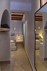A bed or beds in a room at Quartano Luxury Cycladic Residence, Adults Only (13+)