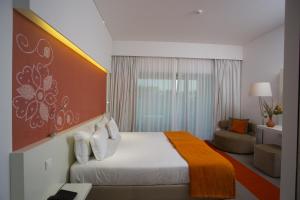 Postel nebo postele na pokoji v ubytování Monte Filipe Hotel