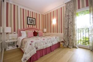 Кровать или кровати в номере Cala del Porto Punta Ala - Preferred Hotels