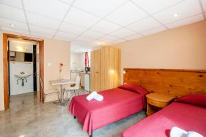 Postel nebo postele na pokoji v ubytování Alborada Apart Hotel