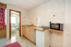 Kuchyň nebo kuchyňský kout v ubytování Alborada Apart Hotel