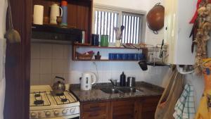 Kuchyň nebo kuchyňský kout v ubytování Homero y Martín Coronado