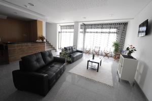 a living room with a couch and a table at Senhor dos Perdoes Alojamento Local in Ribeirão