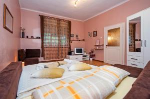 a bedroom with a large bed with two pillows at STELA - One Bedroom Apartment in Rovinj