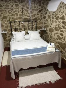 Posteľ alebo postele v izbe v ubytovaní Tu Casa de Pueblo