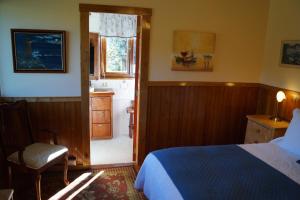 Postel nebo postele na pokoji v ubytování Tradicion Austral Bed & Breakfast