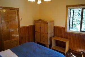 Postel nebo postele na pokoji v ubytování Tradicion Austral Bed & Breakfast