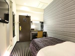 Säng eller sängar i ett rum på APA Hotel Kanda-Eki Higashi