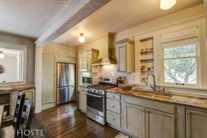 a kitchen with a sink and a stove at *H NEW!* 4BR Centrally Located Lifestyle Bungalow in Colorado Springs