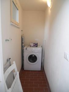 Et badeværelse på Appartamento URANIA - LE MUSE