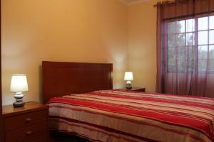 Katil atau katil-katil dalam bilik di Casa do Adro