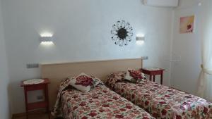 Postel nebo postele na pokoji v ubytování Bed & Breakfast Delle Rose