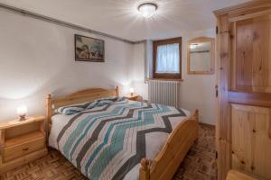 Postel nebo postele na pokoji v ubytování Maison Courthoud Alloggio ad uso turistico - VDA - RHÊMES-SAINT-GEORGES n 0002