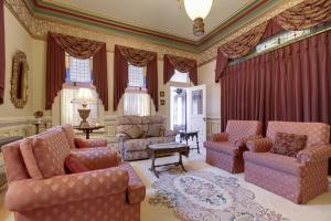 a living room with a couch and chairs and a table at Amethyst Inn in Victoria