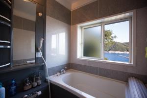 Fotografie z fotogalerie ubytování Tsubaki House v destinaci Anan