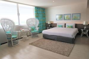 Postel nebo postele na pokoji v ubytování Pearl Hotel Phuket