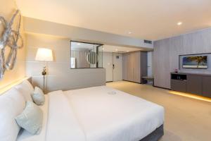 Postel nebo postele na pokoji v ubytování Pearl Hotel Phuket