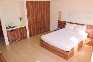 Voodi või voodid majutusasutuse Pico Sands Hotel toas