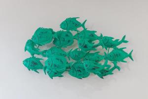 a group of green fish on a white background at Rinkink Beach House in Wilderness
