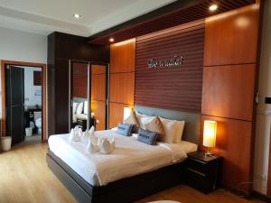 Katil atau katil-katil dalam bilik di Hotel De Wualai