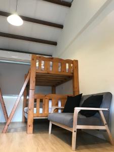 Krevet ili kreveti u jedinici u okviru objekta Donghai Cottage Backpack Inn Suite