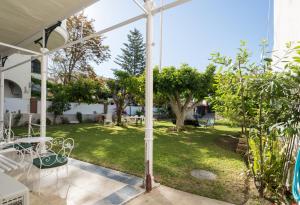 a view of the garden from the patio of a house at Villa Amalia Suites Malaga in Málaga