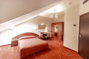 Ein Bett oder Betten in einem Zimmer der Unterkunft Samson Hotel