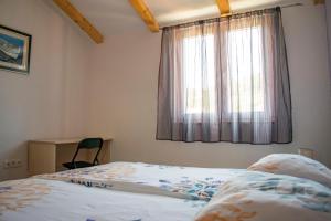 Postel nebo postele na pokoji v ubytování Apartments Linda