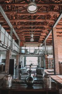 a room with two chairs and a table in a building at Riboville Boutique Hotel And Restaurant in Midrand