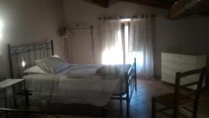 Postel nebo postele na pokoji v ubytování Country House La Fattoria Bellandi