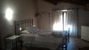 Postel nebo postele na pokoji v ubytování Country House La Fattoria Bellandi