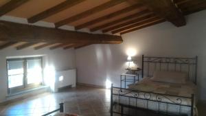 Postel nebo postele na pokoji v ubytování Country House La Fattoria Bellandi