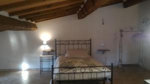 Postel nebo postele na pokoji v ubytování Country House La Fattoria Bellandi
