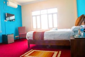 Giường trong phòng chung tại Gorkha Chhen bed & breakfast