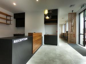 a lobby with a reception desk in a building at Pod Inn in Launceston