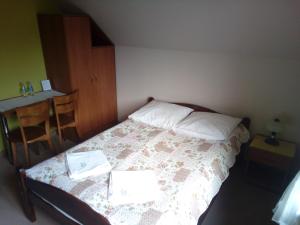Łóżko lub łóżka w pokoju w obiekcie Pokoje Gościnne Pod Wysotą