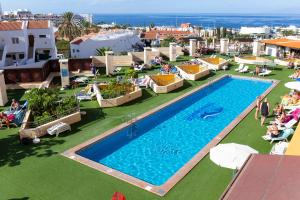 an overhead view of a swimming pool on a resort at Villa De Adeje Beach in Adeje