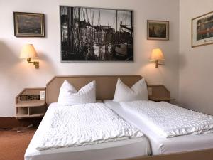 Säng eller sängar i ett rum på Hotel-Landgasthof Grüner Baum - Dittigheim