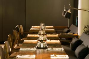 a dining room with a long table and chairs at Habita, Mexico City, a Member of Design Hotels in Mexico City