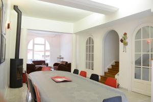 a dining room with a table and chairs at Lille Avenue in Lille