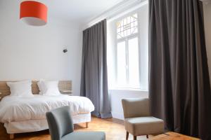 Ένα ή περισσότερα κρεβάτια σε δωμάτιο στο Lille Avenue