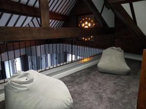 a living room with a chair and a fireplace at The Glebe Hotel in Liverpool