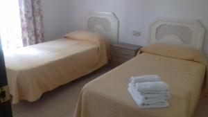 Postel nebo postele na pokoji v ubytování Apartamentos Mediterraneo