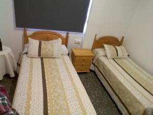 Postel nebo postele na pokoji v ubytování Pensíon Lucia