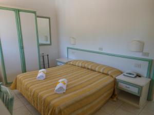 Postel nebo postele na pokoji v ubytování Hotel Due Torri