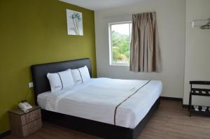 Postel nebo postele na pokoji v ubytování Riverview Hotel