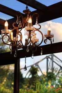 a chandelier hanging from the ceiling of a building at Hotel Blumenhof in Blumenau +101 photos