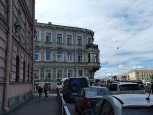 a group of cars parked on a city street at Apartment on Fontanka 60 in Saint Petersburg