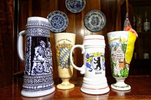 a group of four vases sitting on a table at Hotel Blumenhof in Blumenau